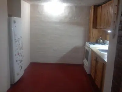 a kitchen with a white refrigerator and a sink at Aires de San Antonio in San Antonio de Arredondo