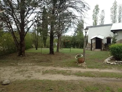 a yard with a house and trees and a street light at Luna Azul in Nono