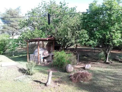 a garden with a play structure in the grass at Luna Azul in Nono