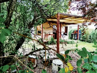 a small house in the middle of a garden at San Antonio Querido in Villa Carlos Paz