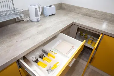 a kitchen counter with a drawer with tools on it at Colores Rio Cuarto in Río Cuarto
