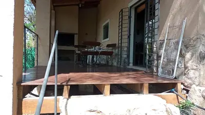 a wooden table on the porch of a house at El Solar in La Bolsa
