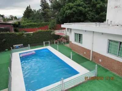 an overhead view of a large swimming pool in a yard at Departamento Carlos Paz in Villa Carlos Paz