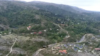 an aerial view of a village on a mountain at Arroyo Escondido in La Cumbrecita