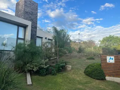 a garden in front of a house at Terralagum in Villa Parque Siquiman