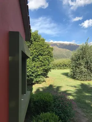 a view of a yard with mountains in the background at Zolara Di Merlo in Merlo