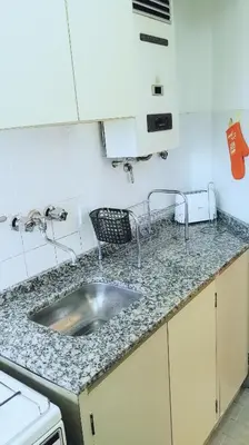a kitchen with a sink and a counter top at Céntrico, Confortable y Cómodo in Cordoba