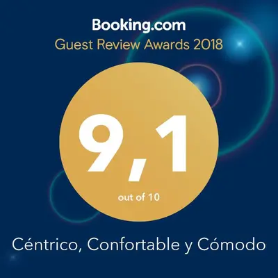 a sign that reads quest review awards with a yellow circle at Céntrico, Confortable y Cómodo in Cordoba