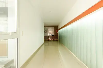 a hallway with green and white walls and a window at Apartamento Obispo Trejo IV by Lofty in Cordoba