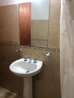 a bathroom with a sink and a mirror at Complejo La Morena in Mina Clavero