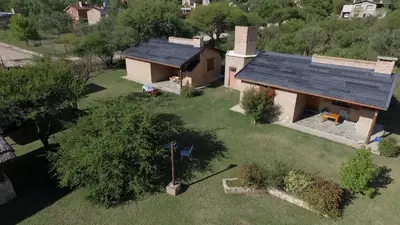 an overhead view of a house with a solar roof at Complejo Sol Serrano in Mina Clavero
