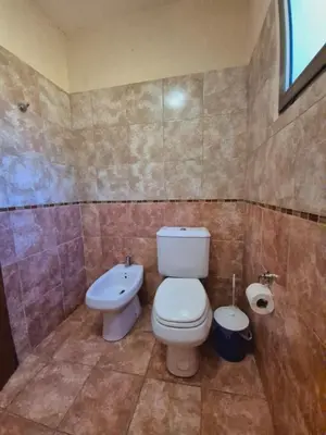 a bathroom with a toilet and a sink at siete colores in Santa Rosa de Calamuchita