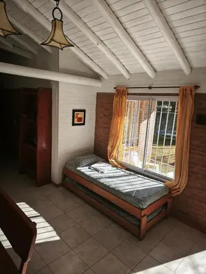 a bed in a room with a window at Alpamayo in Nono