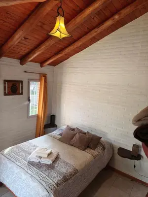 a bedroom with a large bed in a room at Alpamayo in Nono