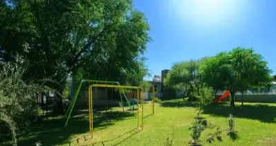 a park with a playground with a slide at Casas Acrux in Nono
