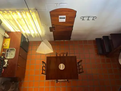 a bathroom with a wooden box on the wall at Posada Altos Del Consuelo in Nono