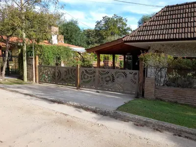 a driveway with a gate in front of a house at 