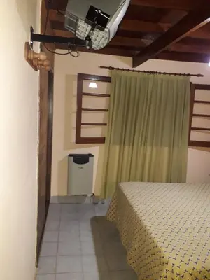 a room with a bed and a window with a spotlight at 
