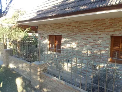 a fence on the side of a brick house at 