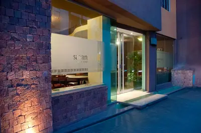 a store front of a building at night at Savannah Cordoba Hotel in Cordoba