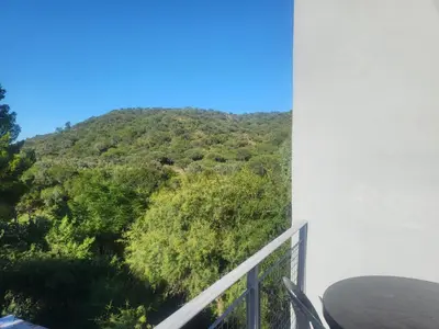 a balcony with a view of a mountain at Cabañas Don Eduardo in Mina Clavero