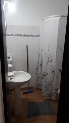 a bathroom with a sink and a shower at La Nona in Villa Cura Brochero