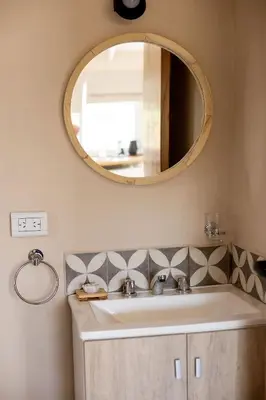 a bathroom with a sink and a mirror at Las Quimeras in Nono