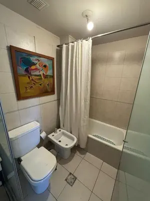 a bathroom with a toilet and a shower at Departamento Premiun En Zona Centro in Cordoba