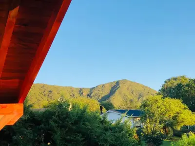 a view of a mountain from a house at El Refugio Casas de Campo in Villa General Belgrano