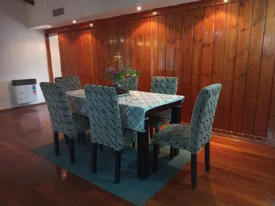 a dining room table and chairs with a table at Espectacular casa in Cordoba