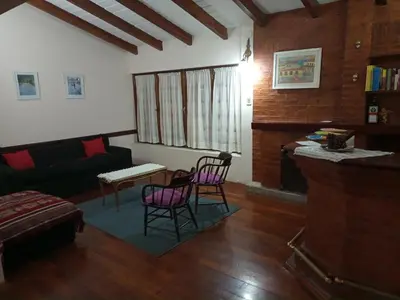 a living room with two chairs and a couch at Espectacular casa in Cordoba