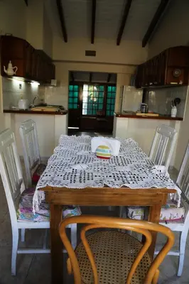 a table in a kitchen with a table and chairs at Espectacular casa in Cordoba