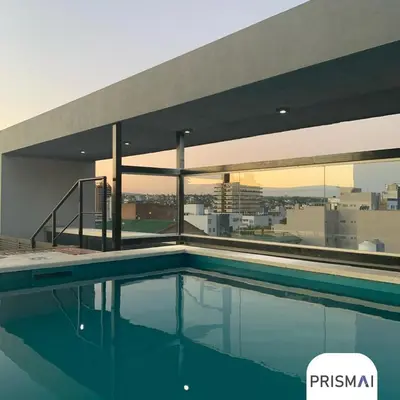 a swimming pool on the roof of a building at Edificio PRISMA I in Villa Carlos Paz