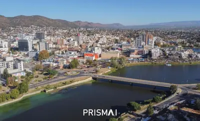 an aerial view of a city with a bridge over a lake at Edificio PRISMA I in Villa Carlos Paz