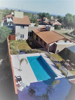 an aerial view of a house with a swimming pool at Hostería Boutique El Puente Adults Only in Merlo