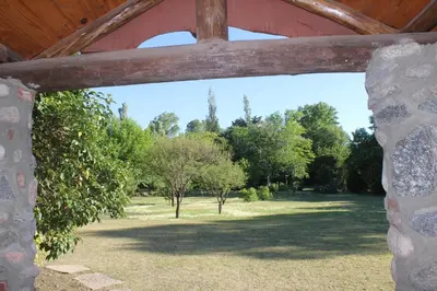 a view through a stone window of a park at La Casa de Wanda in Villa de Las Rosas