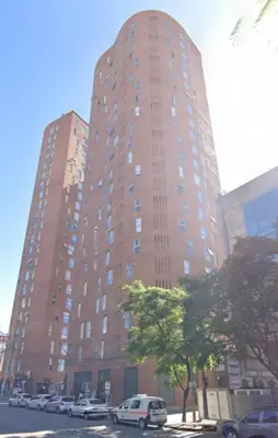 a tall building with cars parked in front of it at ALOHA Güemes Premium, 2 dorm con Vista a las Sierras in Cordoba