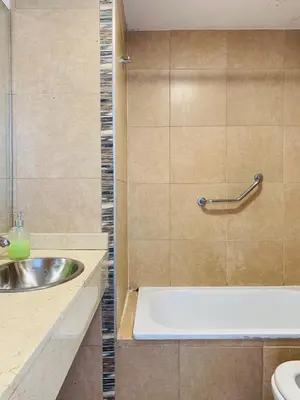 a bathroom with a sink and a bath tub at ALOHA Güemes Premium, 2 dorm con Vista a las Sierras in Cordoba