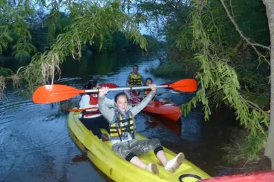 a group of people in a kayak on a river at Corral de Pirca in Los Reartes