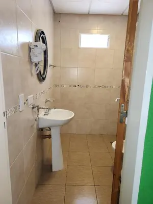 a bathroom with a sink and a mirror at Complejo M&M in Bialet Massé