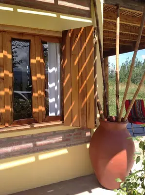 a large vase sitting on a window sill at Cabañas Vientos del Sur in Villa Yacanto
