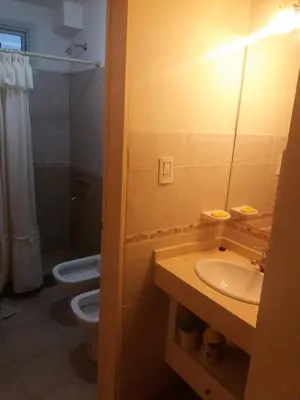 a bathroom with a sink and a toilet at Departamento Carlos Paz in Villa Carlos Paz