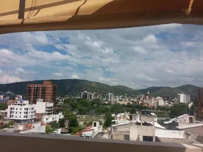 a view of a city from a window at Departamento Carlos Paz in Villa Carlos Paz