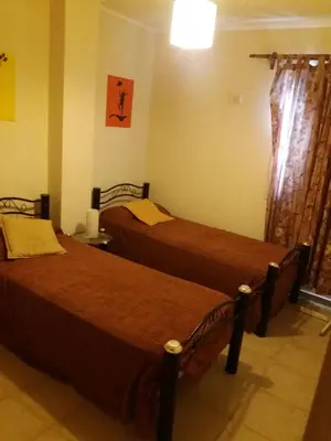 a bedroom with two beds in a room at Departamento Carlos Paz in Villa Carlos Paz