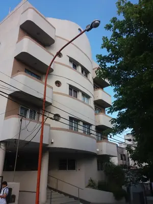 a building with a street light in front of it at Departamento Carlos Paz in Villa Carlos Paz