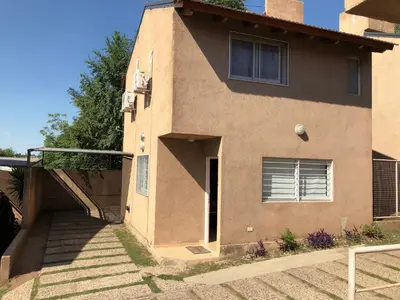 a house with a staircase leading up to a door at Dpto El Nilo Carlos Villa Paz in Villa Independencia