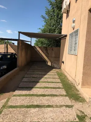 a stairway leading up to a building with a ramp at Dpto El Nilo Carlos Villa Paz in Villa Independencia