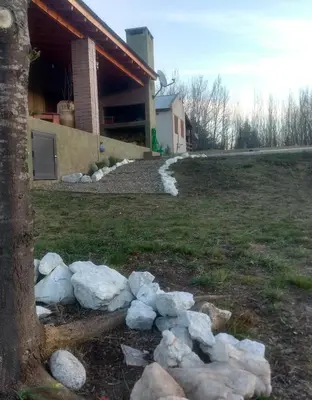 a pile of rocks in front of a house at Libertad in Villa Yacanto
