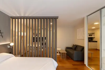 a bedroom with a bed and a couch and a table at B131 - Argentina in Cordoba