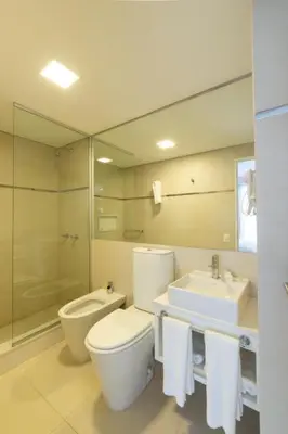 a bathroom with a toilet and a sink and a mirror at B131 - Argentina in Cordoba